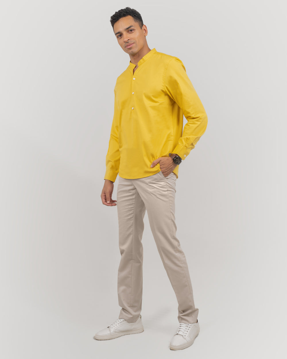 Comfortable traditional yellow short kurta for men, ideal for casual and festive wear.